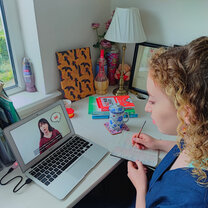 Private Japanese Online lessons; Girl in front of laptop studying Japanese online with a private tutor