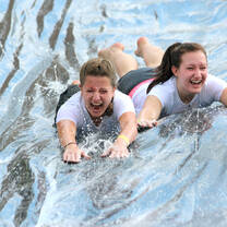 Student activity day on the slip and slide