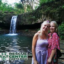 volunteers by waterfall