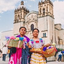 Indigenous girls in front Santo Domingo church in Oaxaca