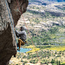 A student rock climbing