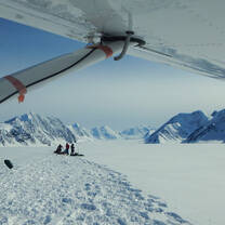 Students being resupplied by bush plane 