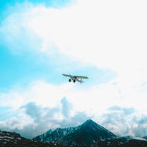 Bush plane flying away after resupply 