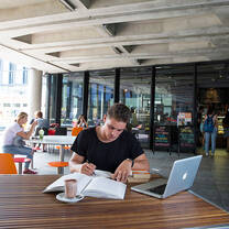 Intern working outside at a table