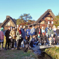 KCP students pose by the gassho-zukuri style houses in Gifu