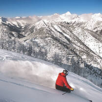 Sunpeaks Skier downhill red jacket