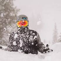 Snowboarder sat in Powder