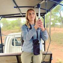 Volunteer using telemetry to track rhino