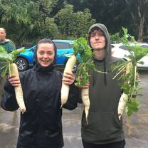 Students with freshly harvested vegetables