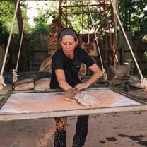 Volunteers helping to build water filters to provide clean drinking water to rural villages