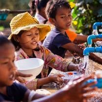 Volunteers helping to build water filters to provide clean drinking water to rural villages
