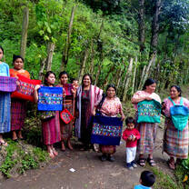 Weavers showing off their hand-woven pillows