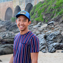 student smiling on the beach