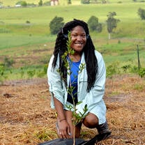student planting a tree