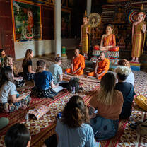 Students speaking with Buddhist monks
