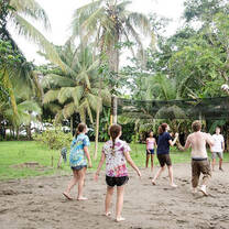 Volunteers play volleyball on the beach at the Sea Turtle Rescue Project in Costa Rica