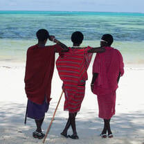 Three Massai Warriors on an Indian Ocean beach
