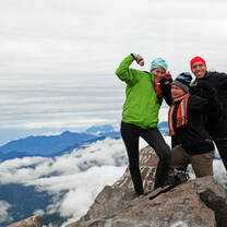 group of hikers at the summit of a volcano in Guatemala