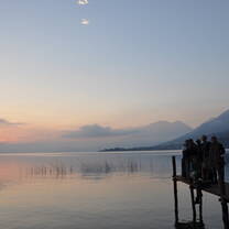 group sitting on a dock on Lake Atitlan in Guatemala