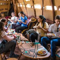 Enjoying a delicious home-cooked meal at Kausay Punku group eating a meal at Kausay Punku