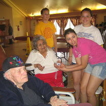 High school students assist elders High school students assist elders