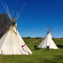 A photo of two teepees