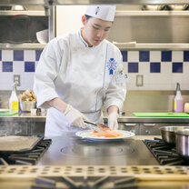 Students in the kitchen during Cuisine Diploma program at Le Cordon Bleu