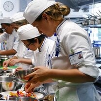 Students in the kitchen during Cuisine Diploma program at Le Cordon Bleu