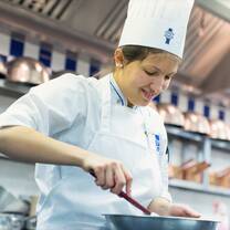 Students in the kitchen during Cuisine Diploma program at Le Cordon Bleu