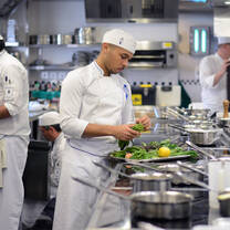 Students in the kitchen during Cuisine Diploma program at Le Cordon Bleu