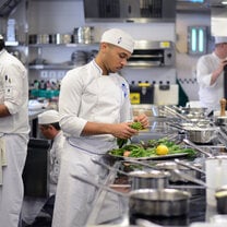 Students in the kitchen during Cuisine Diploma program at Le Cordon Bleu