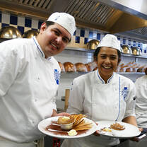 Students in the kitchen during Cuisine Diploma program at Le Cordon Bleu