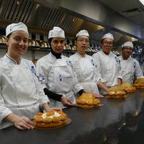 Students in the kitchen during Cuisine Diploma program at Le Cordon Bleu