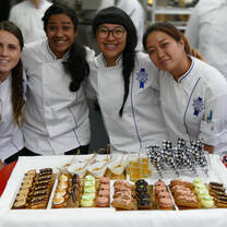 Students in the kitchen during Cuisine Diploma program at Le Cordon Bleu