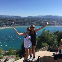 Two Horizons Abroad summer Spanish immersion students with smiling on a hill above San Sebastian, Spain