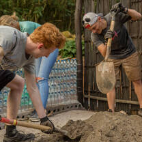 Projects Abroad volunteers hard at work building on the Conservation Project