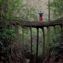 Man standing on natural bridge