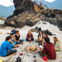 Students sitting on the Banks of the Ganga
