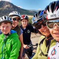 Students´s family biking with the teacher and her daughter