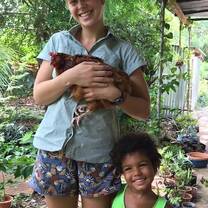 Hanging with a chicken and host sister in Zanzibar