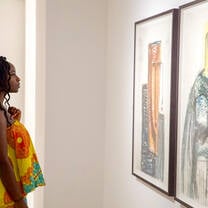 Student admiring art in a museum