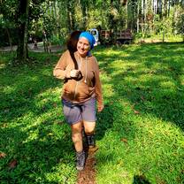 Volunteer taking care of a monkey on her shoulder