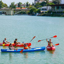 Students Kayaking on River 