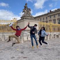Students jumping in front of Palace