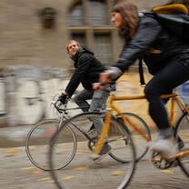 Two students riding bicycles