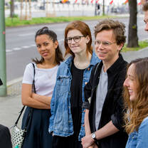 Students standing outside, smiling