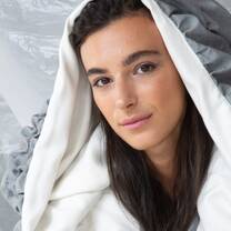 Model displaying hooded garment created by students of Accademia del Lusso