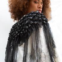 A model looking over her shoulder displaying a fashion student creation from Accademia del Lusso Milan
