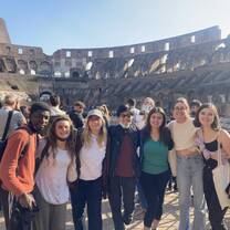 Group of students standing in front of the Colosseum