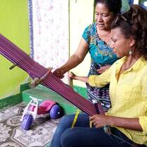 Grad Stacey learning to weave in Guatemala